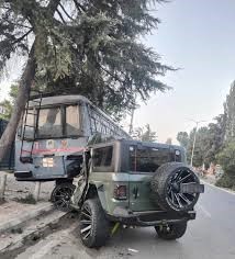 Injured individuals receiving medical attention after a road accident in Srinagar